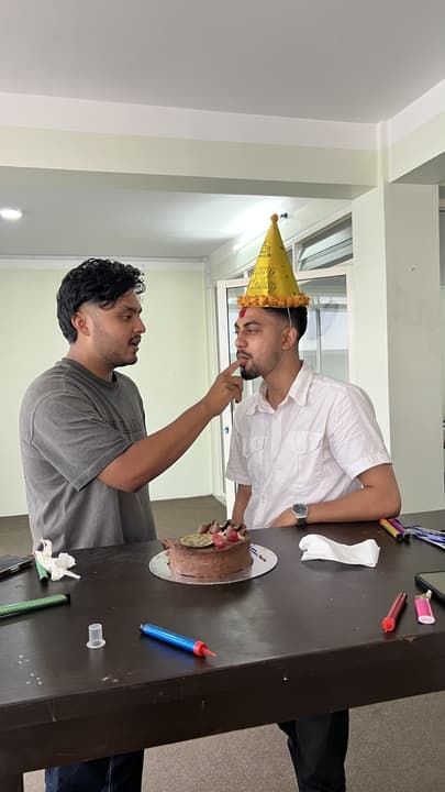 Inseed teammates sharing a birthday moment at the Kathmandu studio